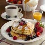 Pancakes: The Ultimate Guide to Fluffy, Delicious Pancakes Every Time 6 Serving pancakes with berries