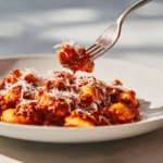 Serving of cauliflower gnocchi bolognese