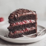 Chocolate Raspberry Cake Recipe With Dark Chocolate and Fresh Raspberries 6 Dishfeast chocolate raspberry cake slice serving